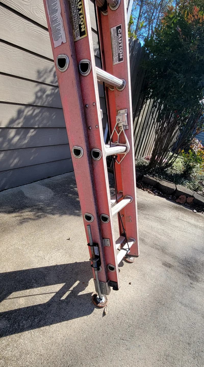 24ft fiberglass extension ladder with levelers — photo 3 of 3