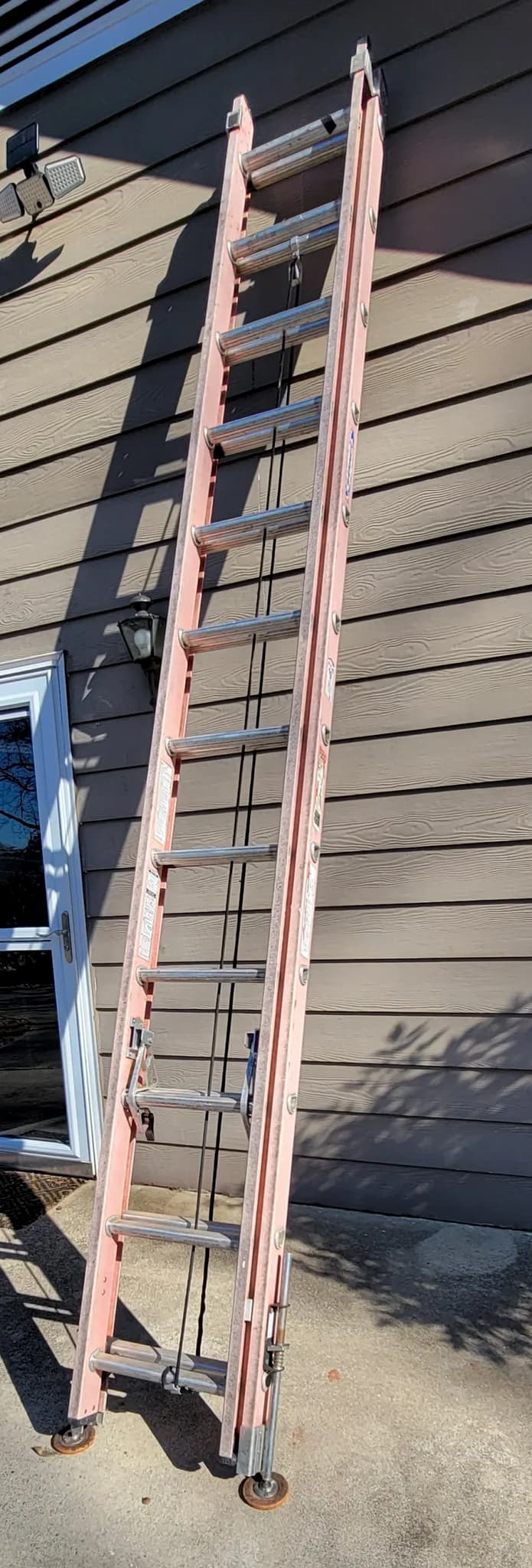 24ft fiberglass extension ladder with levelers — photo 2 of 3